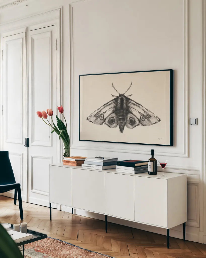 Moth II by Avery Tillmon. shown as a framed stretched canvas in a living room above a console. Available as a archival giclee rolled canvas, fine art paper, or poster print. SKU 76815i.