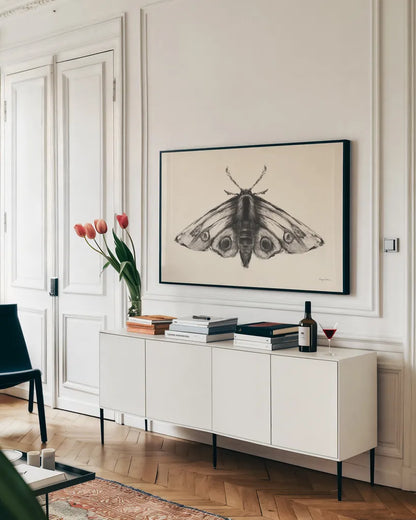 Moth II by Avery Tillmon. shown as a framed stretched canvas in a living room above a console. Available as a archival giclee rolled canvas, fine art paper, or poster print. SKU 76815i.