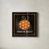Trick or Treat Pumpkin by Avery Tillmon. Shown in a sleek black glass frame for a contemporary gallery look. Available as an archival giclee rolled canvas, fine art paper, or poster print. SKU 57885a.