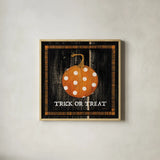 Trick or Treat Pumpkin by Avery Tillmon. Shown in a natural wood glass frame for a timeless modern aesthetic. Available as an archival giclee rolled canvas, fine art paper, or poster print. SKU 57885a.