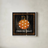 Trick or Treat Pumpkin by Avery Tillmon. Shown in a crisp white glass frame for a clean and minimalist style. Available as an archival giclee rolled canvas, fine art paper, or poster print. SKU 57885a.