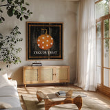 Trick or Treat Pumpkin by Avery Tillmon. Shown in a natural wood frame in a cozy modern living room. Available as an archival giclee rolled canvas, fine art paper, or poster print. SKU 57885a.