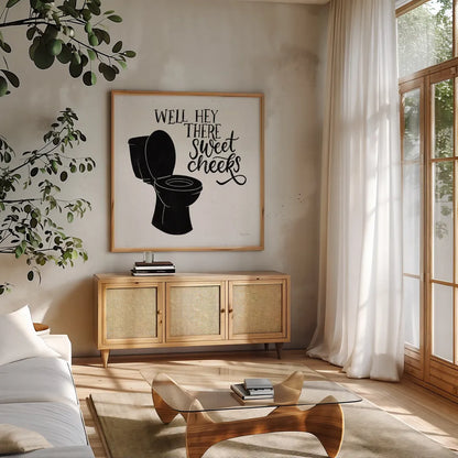 Bathroom Puns III Black Sq by Becky Thorns. Shown in a natural wood frame in a cozy modern living room. Available as an archival giclee rolled canvas, fine art paper, or poster print. SKU 89252a.