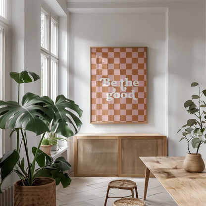 Be the Good II Checkered by Becky Thorns. shown as a print in a natural wood frame in a dining room. Available as a archival giclee rolled canvas, fine art paper, or poster print. SKU 87458h.