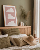 Boho Nursery Clouds by Becky Thorns. shown as a paper print in a natural frame. Available as a archival giclee rolled canvas, fine art paper, or poster print. SKU 71372h.