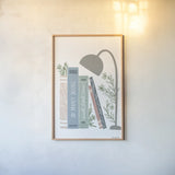 Bookish Blue I v2 by Becky Thorns. shown as a paper print in a natural frame. Available as a archival giclee rolled canvas, fine art paper, or poster print. SKU 101554h.