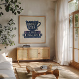 Bookish Blue IV by Becky Thorns. Shown in a natural wood frame in a cozy modern living room. Available as an archival giclee rolled canvas, fine art paper, or poster print. SKU 97122a.
