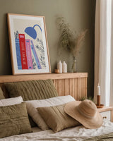 Bookish I by Becky Thorns. shown as a paper print in a natural frame. Available as a archival giclee rolled canvas, fine art paper, or poster print. SKU 97115h.