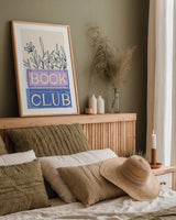 Bookish II by Becky Thorns. shown as a paper print in a natural frame. Available as a archival giclee rolled canvas, fine art paper, or poster print. SKU 97116h.