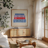 Bookish III by Becky Thorns. Shown in a natural wood frame in a cozy modern living room. Available as an archival giclee rolled canvas, fine art paper, or poster print. SKU 97117a.