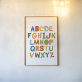 Colorful Alphabet by Becky Thorns. shown as a paper print in a natural frame. Available as a archival giclee rolled canvas, fine art paper, or poster print. SKU 59586h.
