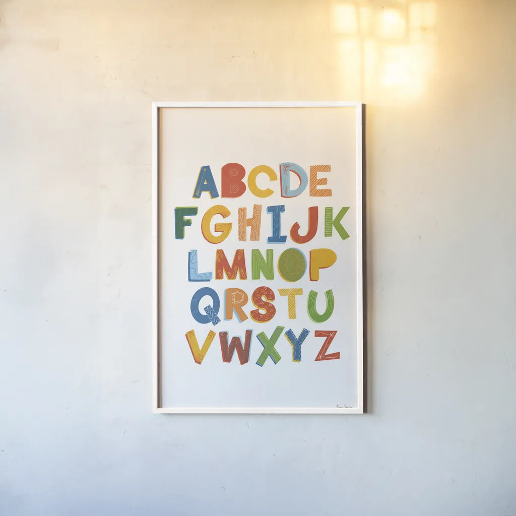 Colorful Alphabet by Becky Thorns. shown as a paper print in a white frame. Available as a archival giclee rolled canvas, fine art paper, or poster print. SKU 59586h.
