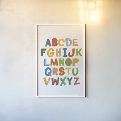 Colorful Alphabet by Becky Thorns. shown as a paper print in a white frame. Available as a archival giclee rolled canvas, fine art paper, or poster print. SKU 59586h.