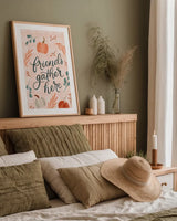 Friendsgiving I by Becky Thorns. shown as a paper print in a natural frame. Available as a archival giclee rolled canvas, fine art paper, or poster print. SKU 80043h.