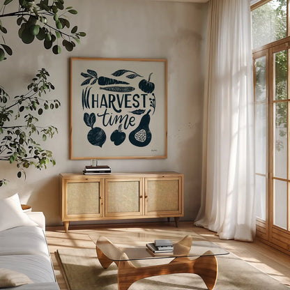 Harvest Lettering I Blue by Becky Thorns. Shown in a natural wood frame in a cozy modern living room. Available as an archival giclee rolled canvas, fine art paper, or poster print. SKU 75121a.