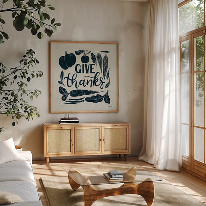 Harvest Lettering II Blue by Becky Thorns. Shown in a natural wood frame in a cozy modern living room. Available as an archival giclee rolled canvas, fine art paper, or poster print. SKU 75122a.