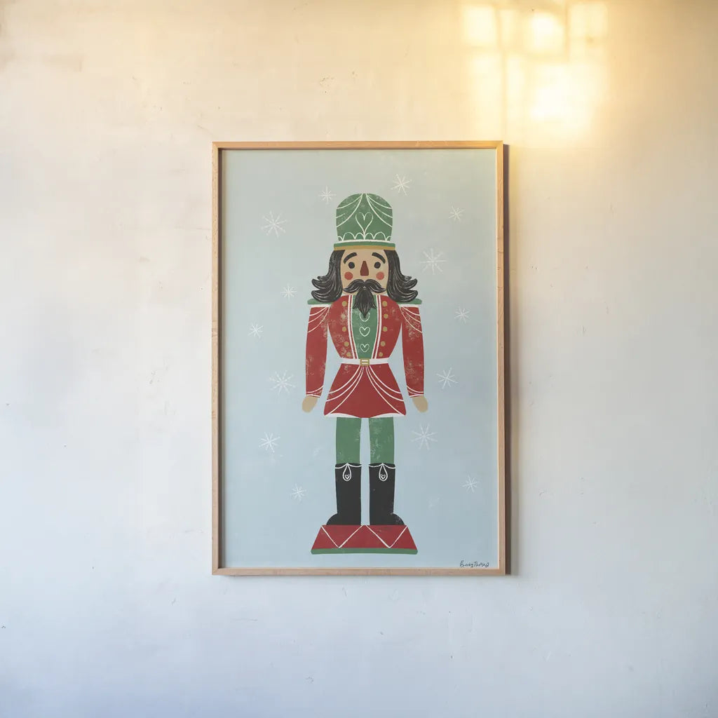 Holiday Cheer Nutcrackers I by Becky Thorns. shown as a paper print in a natural frame. Available as a archival giclee rolled canvas, fine art paper, or poster print. SKU 83912h.