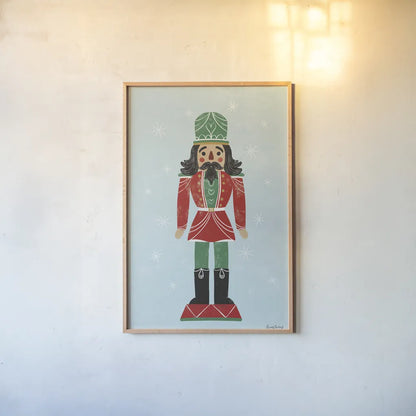 Holiday Cheer Nutcrackers I by Becky Thorns. shown as a paper print in a natural frame. Available as a archival giclee rolled canvas, fine art paper, or poster print. SKU 83912h.