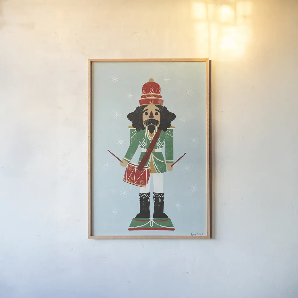 Holiday Cheer Nutcrackers IV by Becky Thorns. shown as a paper print in a natural frame. Available as a archival giclee rolled canvas, fine art paper, or poster print. SKU 83915h.