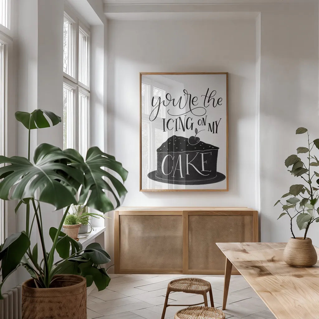 Icing On My Cake BW by Becky Thorns. shown as a print in a natural wood frame in a dining room. Available as a archival giclee rolled canvas, fine art paper, or poster print. SKU 61421h.