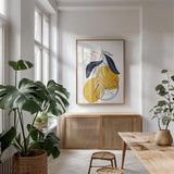 Lemons II by Becky Thorns. shown as a print in a natural wood frame in a dining room. Available as a archival giclee rolled canvas, fine art paper, or poster print. SKU 64703h.
