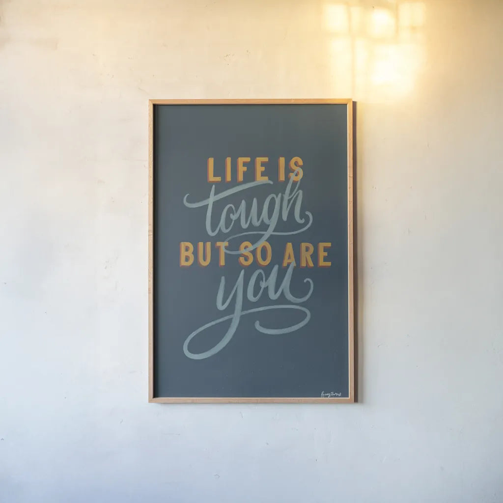 Life is Tough by Becky Thorns. shown as a paper print in a natural frame. Available as a archival giclee rolled canvas, fine art paper, or poster print. SKU 51864h.