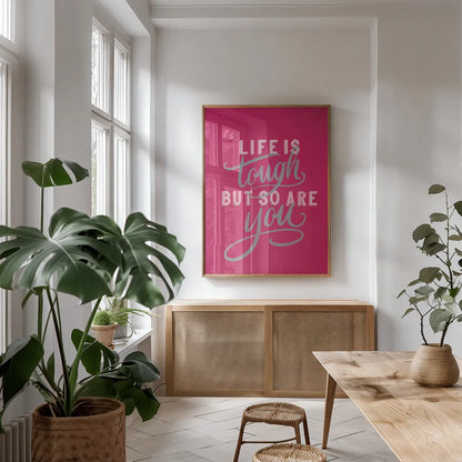 Life is Tough Bright Rose by Becky Thorns. shown as a print in a natural wood frame in a dining room. Available as a archival giclee rolled canvas, fine art paper, or poster print. SKU 58406h.