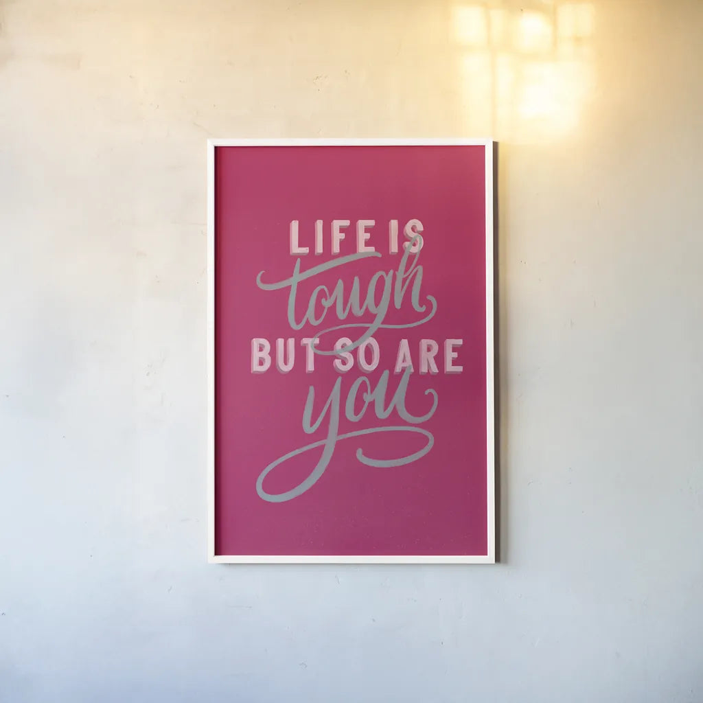 Life is Tough Bright Rose by Becky Thorns. shown as a paper print in a white frame. Available as a archival giclee rolled canvas, fine art paper, or poster print. SKU 58406h.