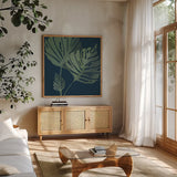 Monstera III by Becky Thorns. Shown in a natural wood frame in a cozy modern living room. Available as an archival giclee rolled canvas, fine art paper, or poster print. SKU 52081a.