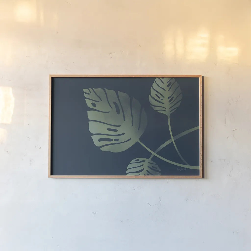 Monstera V by Becky Thorns. shown as a paper print in a natural frame. Available as a archival giclee rolled canvas, fine art paper, or poster print. SKU 52083i.