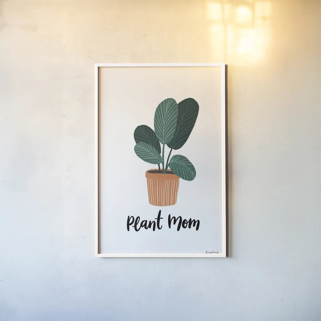 Plant Mom by Becky Thorns. shown as a paper print in a white frame. Available as a archival giclee rolled canvas, fine art paper, or poster print. SKU 65070h.