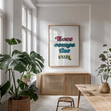 Rainbow Here Comes the Sun Bold by Becky Thorns. shown as a print in a natural wood frame in a dining room. Available as a archival giclee rolled canvas, fine art paper, or poster print. SKU 65214h.