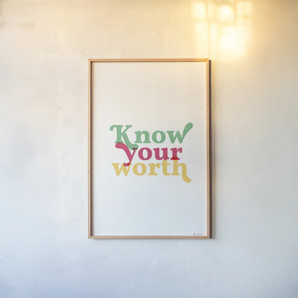 Rainbow Know Your Worth by Becky Thorns. shown as a paper print in a natural frame. Available as a archival giclee rolled canvas, fine art paper, or poster print. SKU 65204h.