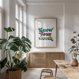 Rainbow Know Your Worth Bold by Becky Thorns. shown as a print in a natural wood frame in a dining room. Available as a archival giclee rolled canvas, fine art paper, or poster print. SKU 65217h.