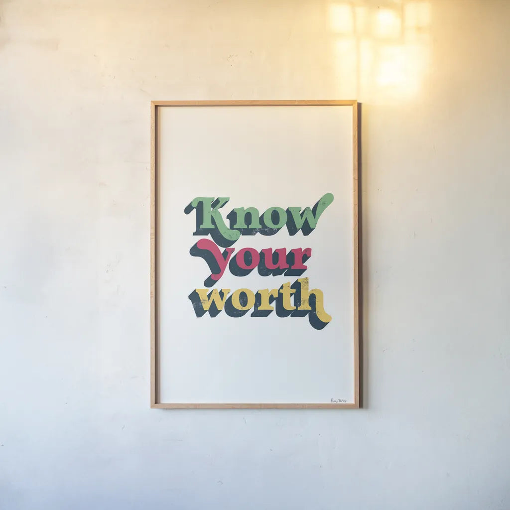 Rainbow Know Your Worth Bold by Becky Thorns. shown as a paper print in a natural frame. Available as a archival giclee rolled canvas, fine art paper, or poster print. SKU 65217h.