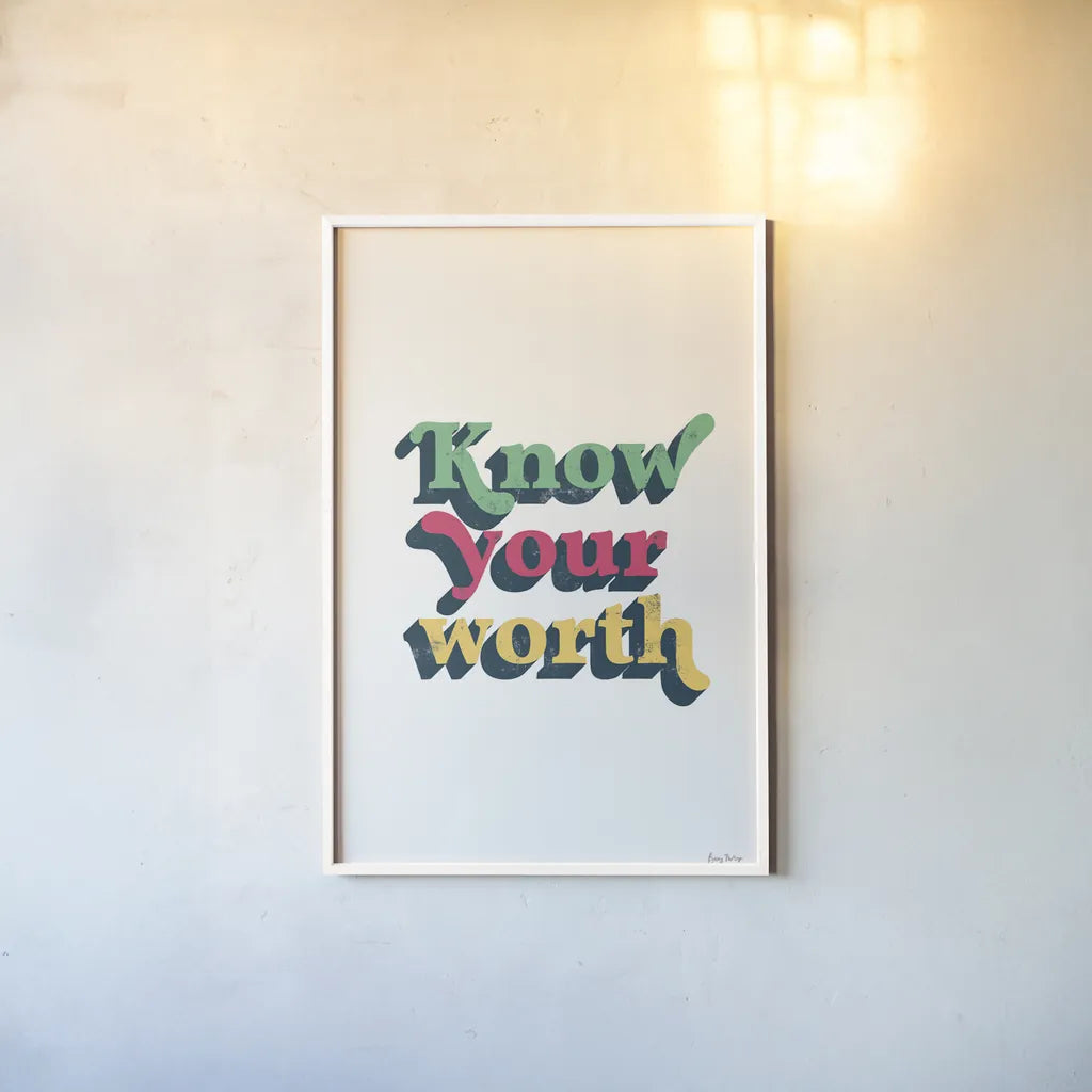 Rainbow Know Your Worth Bold by Becky Thorns. shown as a paper print in a white frame. Available as a archival giclee rolled canvas, fine art paper, or poster print. SKU 65217h.