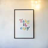Rainbow Take it Easy by Becky Thorns. shown as a paper print in a black flame. Available as a archival giclee rolled canvas, fine art paper, or poster print. SKU 65208h.