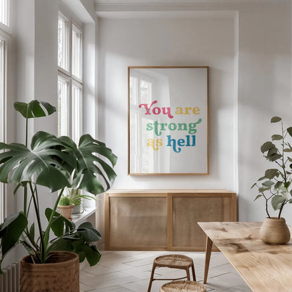 Rainbow You Are Strong by Becky Thorns. shown as a print in a natural wood frame in a dining room. Available as a archival giclee rolled canvas, fine art paper, or poster print. SKU 65206h.