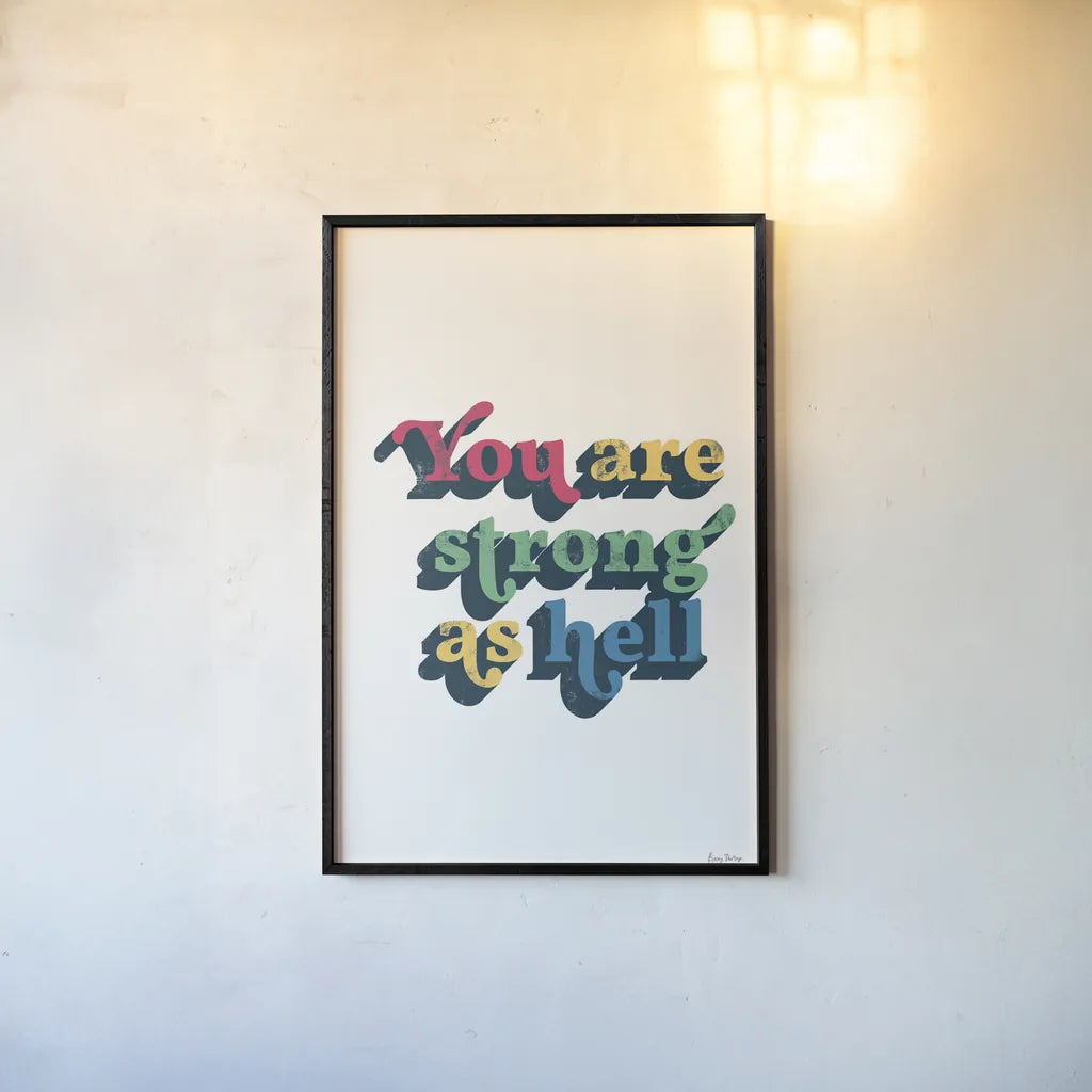 Rainbow You Are Strong Bold by Becky Thorns. shown as a paper print in a black flame. Available as a archival giclee rolled canvas, fine art paper, or poster print. SKU 65215h.