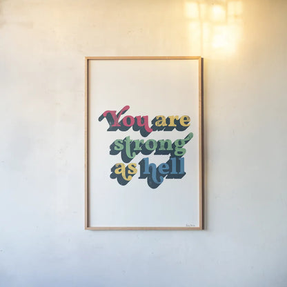 Rainbow You Are Strong Bold by Becky Thorns. shown as a paper print in a natural frame. Available as a archival giclee rolled canvas, fine art paper, or poster print. SKU 65215h.