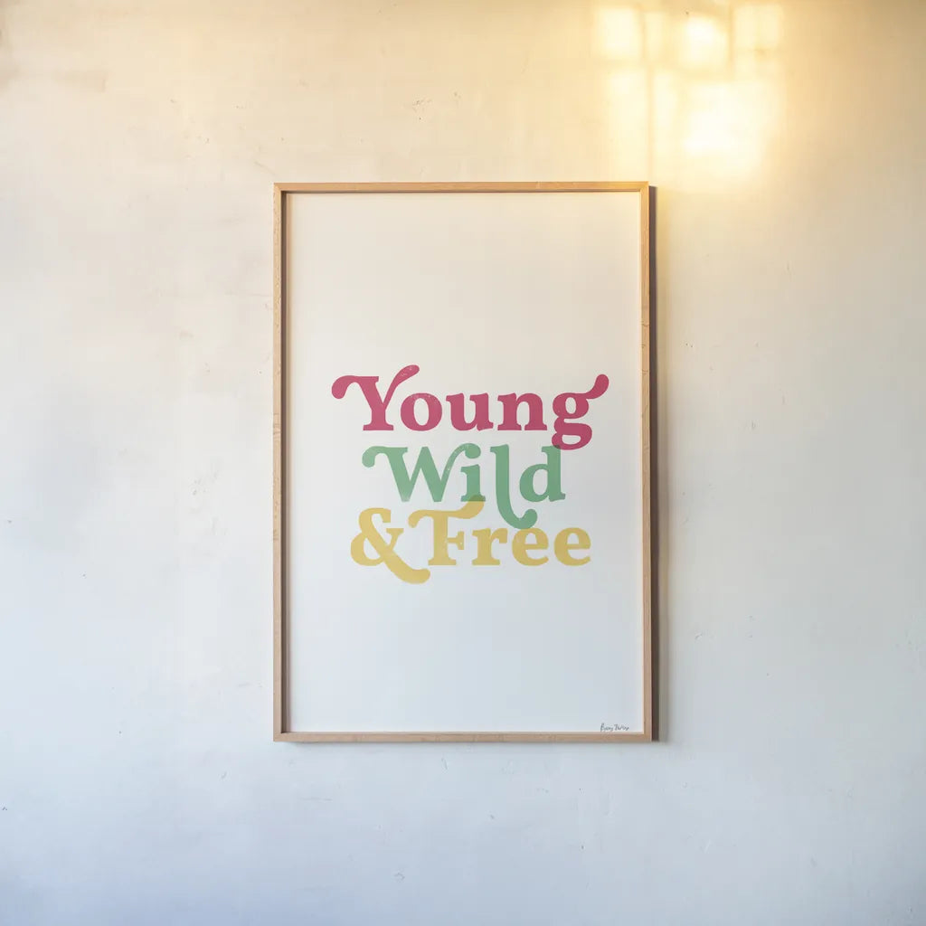 Rainbow Young Wild and Free by Becky Thorns. shown as a paper print in a natural frame. Available as a archival giclee rolled canvas, fine art paper, or poster print. SKU 65207h.