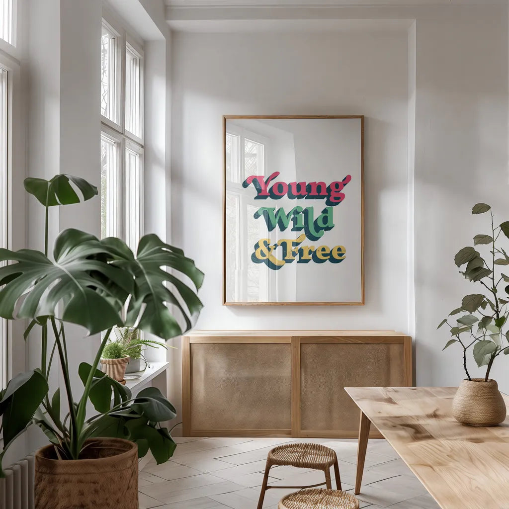 Rainbow Young Wild and Free Bold by Becky Thorns. shown as a print in a natural wood frame in a dining room. Available as a archival giclee rolled canvas, fine art paper, or poster print. SKU 65219h.