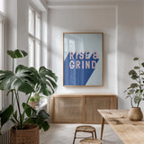 Rise and Grind by Becky Thorns. shown as a print in a natural wood frame in a dining room. Available as a archival giclee rolled canvas, fine art paper, or poster print. SKU 56777h.