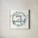 Sage Sayings Wreath III by Becky Thorns. Shown in a crisp white glass frame for a clean and minimalist style. Available as an archival giclee rolled canvas, fine art paper, or poster print. SKU 68252a.