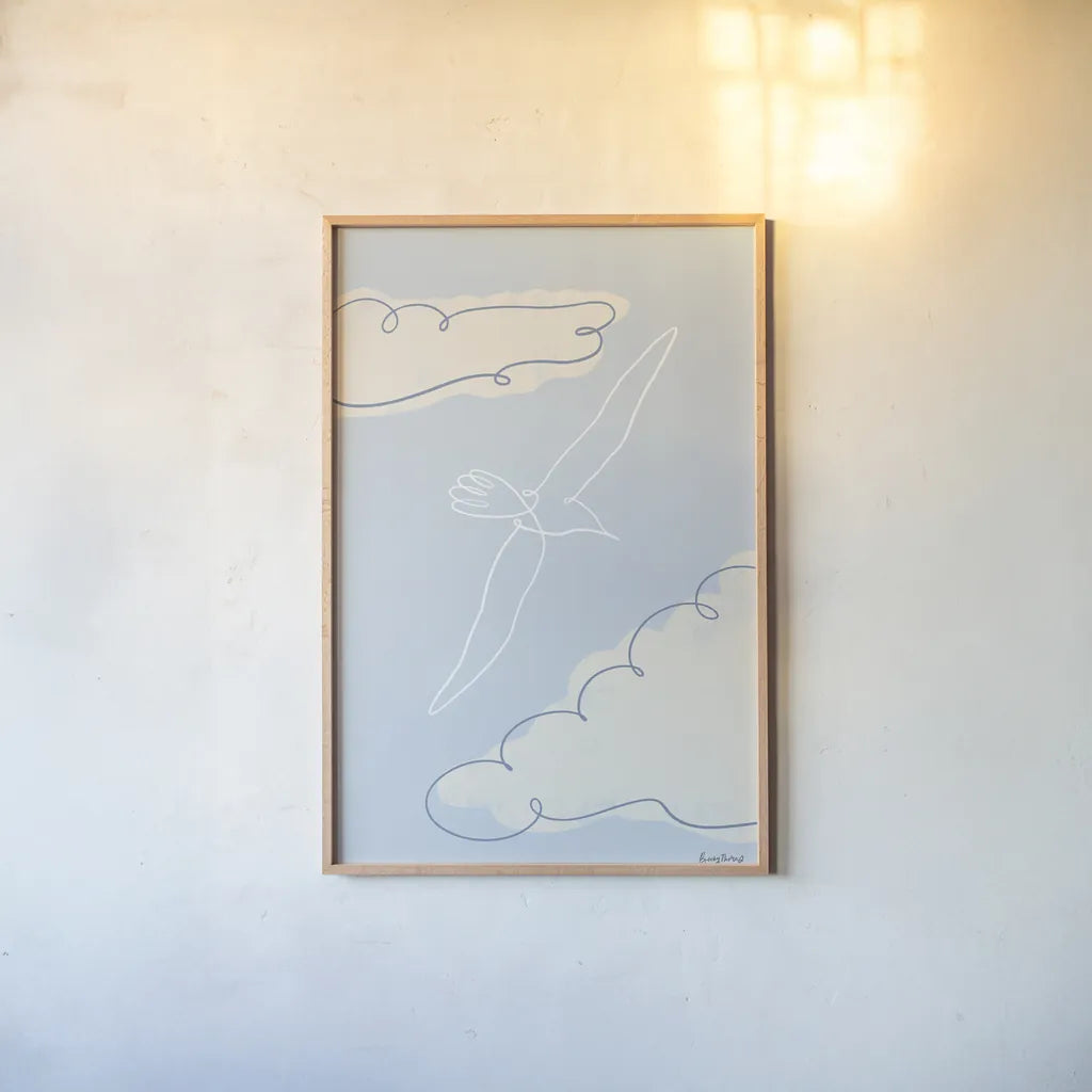 Soaring Seagull I by Becky Thorns. shown as a paper print in a natural frame. Available as a archival giclee rolled canvas, fine art paper, or poster print. SKU 87641h.