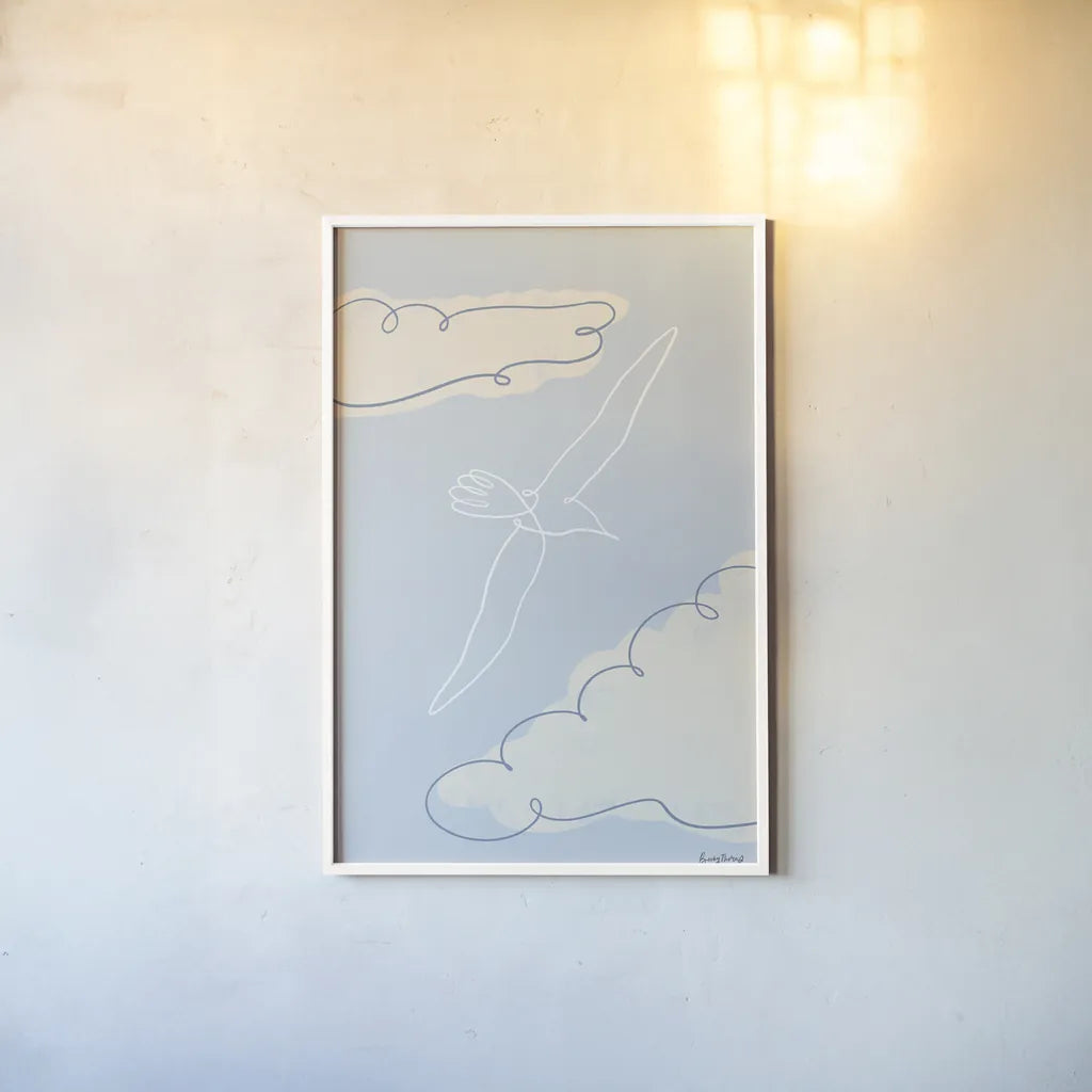 Soaring Seagull I by Becky Thorns. shown as a paper print in a white frame. Available as a archival giclee rolled canvas, fine art paper, or poster print. SKU 87641h.