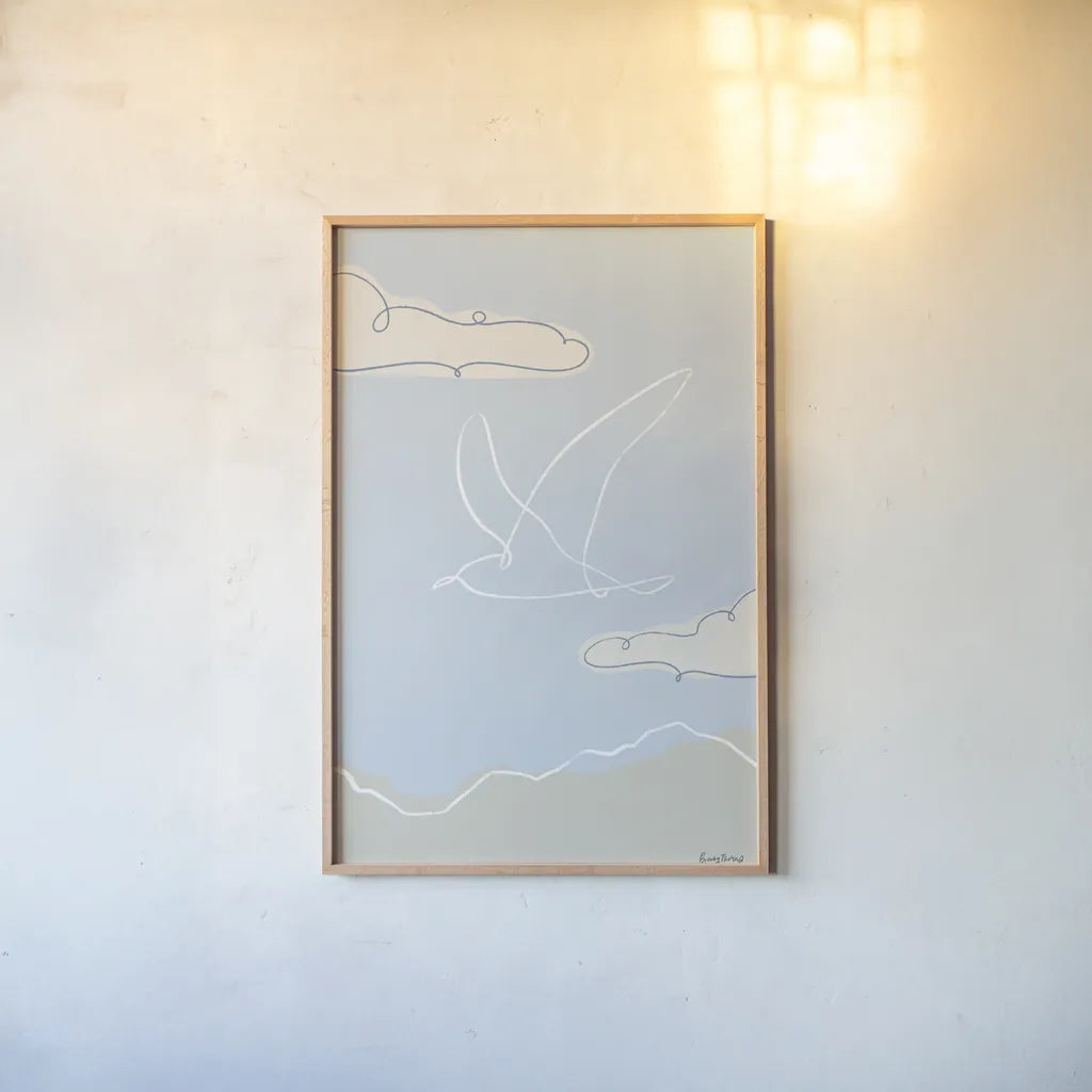 Soaring Seagull II by Becky Thorns. shown as a paper print in a natural frame. Available as a archival giclee rolled canvas, fine art paper, or poster print. SKU 87642h.