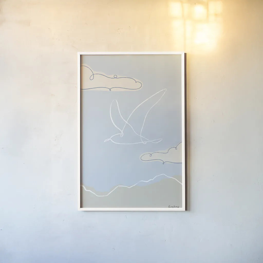 Soaring Seagull II by Becky Thorns. shown as a paper print in a white frame. Available as a archival giclee rolled canvas, fine art paper, or poster print. SKU 87642h.