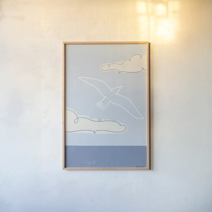 Soaring Seagull III by Becky Thorns. shown as a paper print in a natural frame. Available as a archival giclee rolled canvas, fine art paper, or poster print. SKU 87643h.