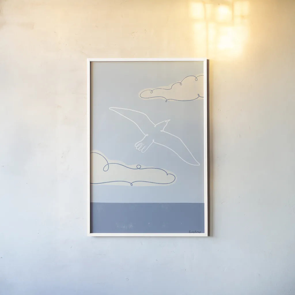 Soaring Seagull III by Becky Thorns. shown as a paper print in a white frame. Available as a archival giclee rolled canvas, fine art paper, or poster print. SKU 87643h.